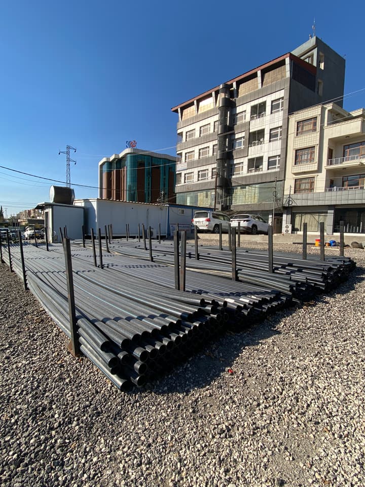 HDPE pipes stacked in a storage yard