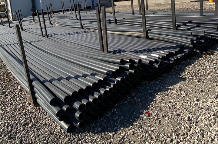 HDPE pipes stacked in a storage yard