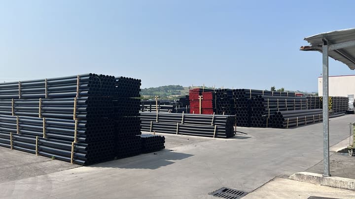 HDPE pipes stacked in a storage yard